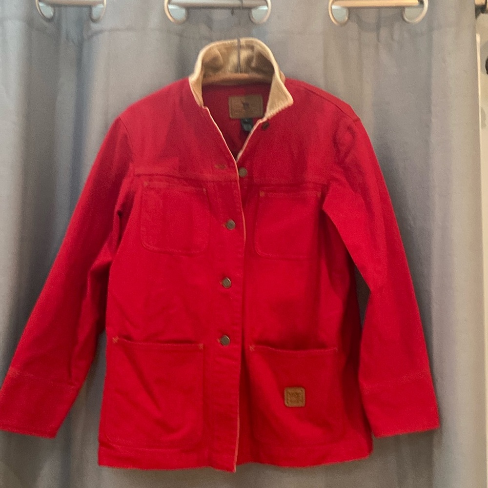 Red barn jacket with tan corduroy trim on collar and cuffs